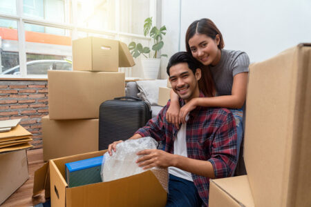 Couple unpacking boxes