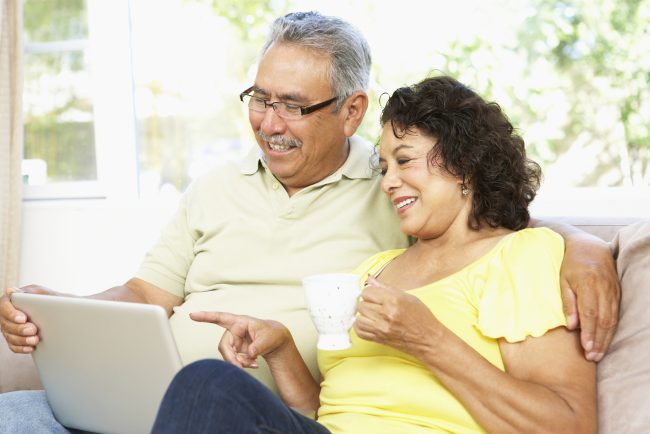 Digital banking older couple on tablet