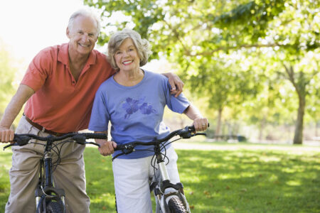 Senior couple riding bikes