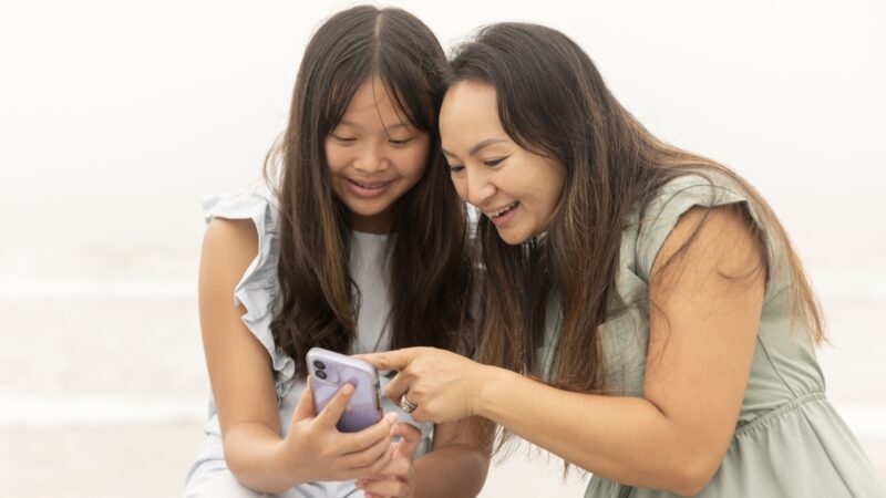 two girls looking at phone